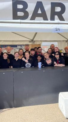 Image showing a group of Viking Staffing & Events staff behind the bar at R Fest smiling